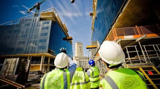 Engineers in S-TRADIX hi-vis vests supervising a construction site